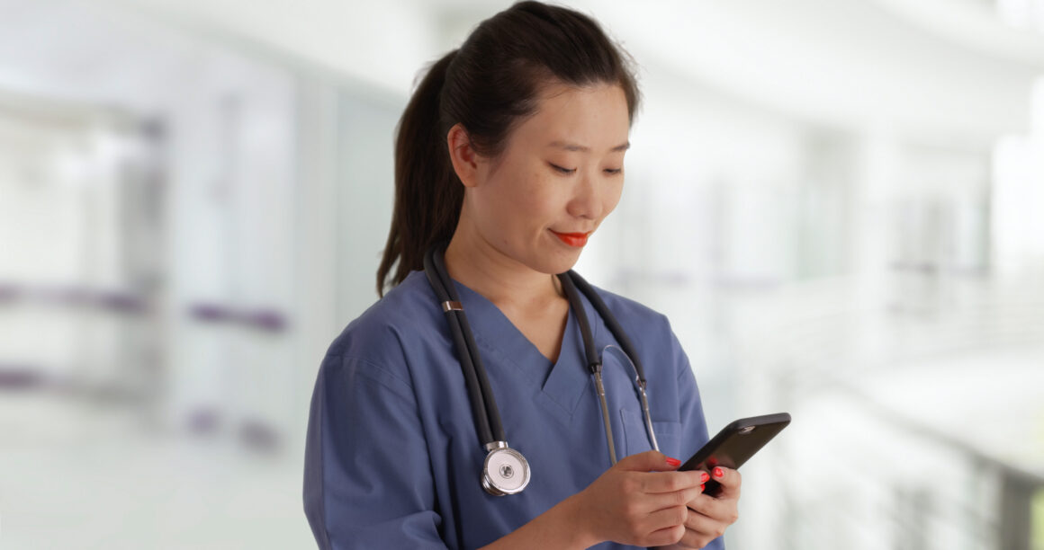 A nurse using her phone.