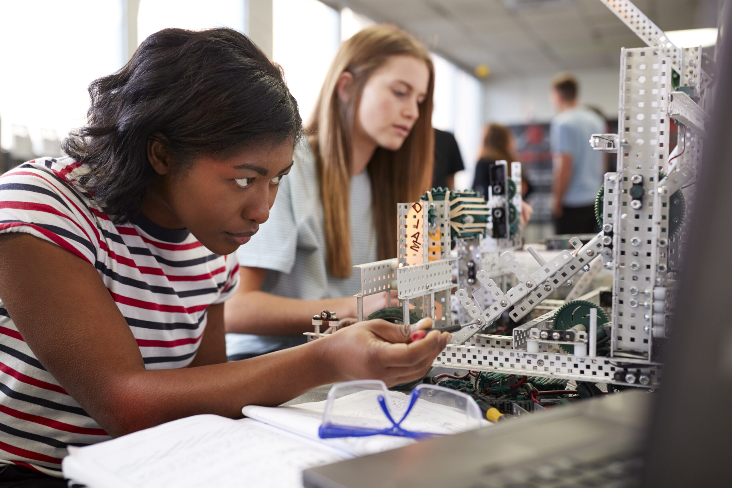 Girls working in a science lab.